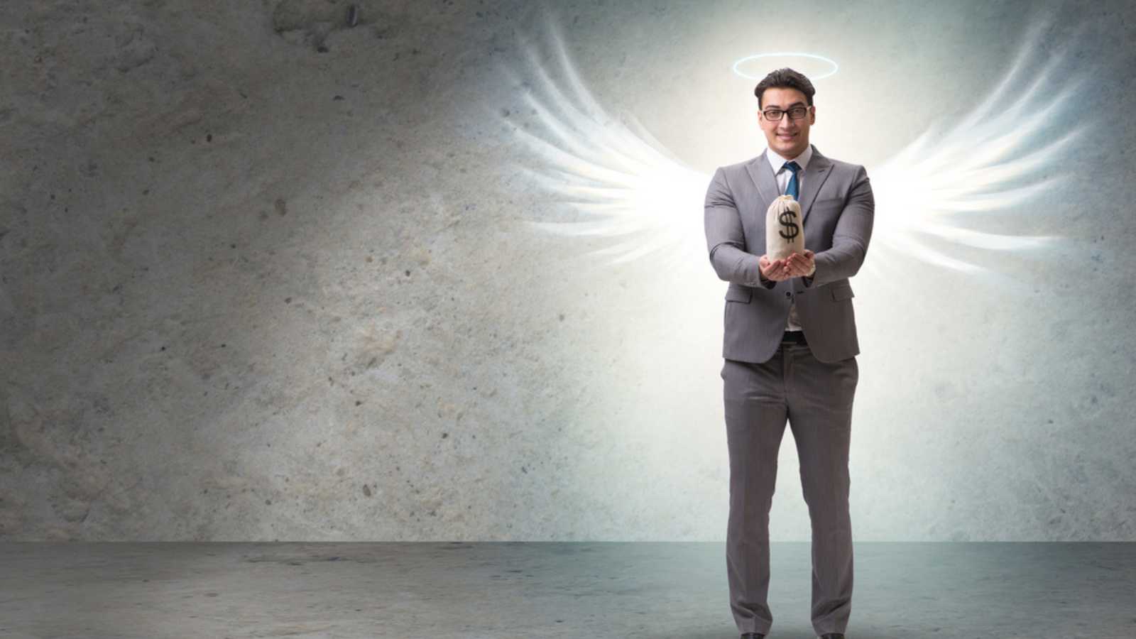 Angel investor concept with businessman with wings