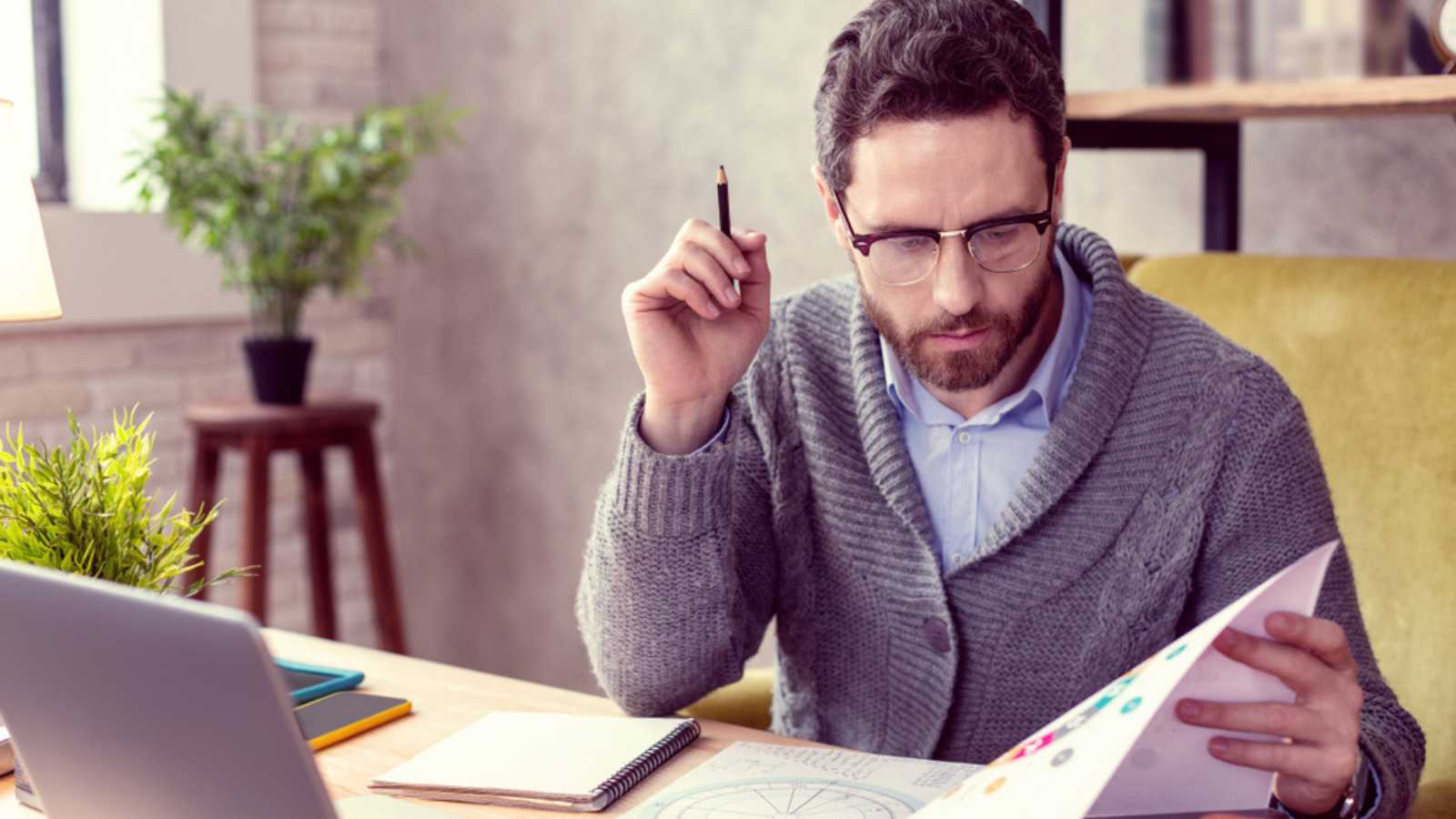 Man checking out papers