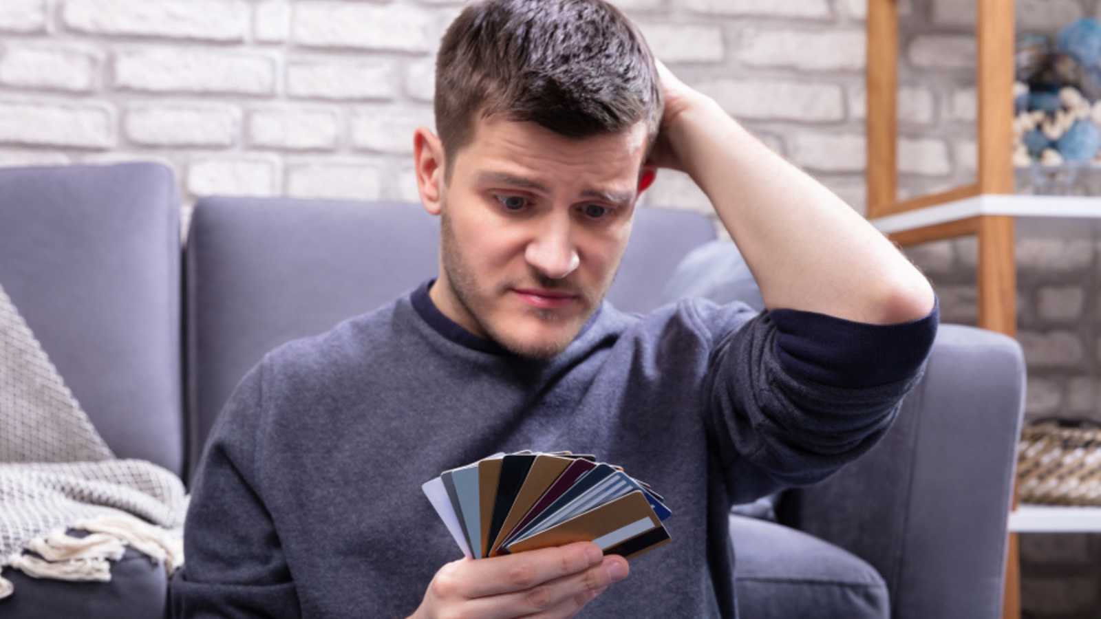 Stressed Man with credit cards