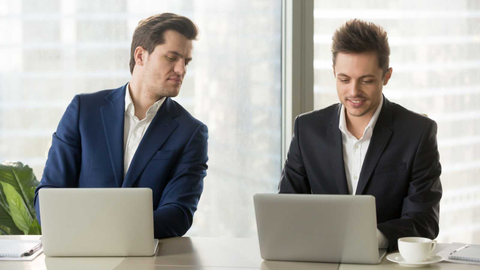 Two men working in computer.