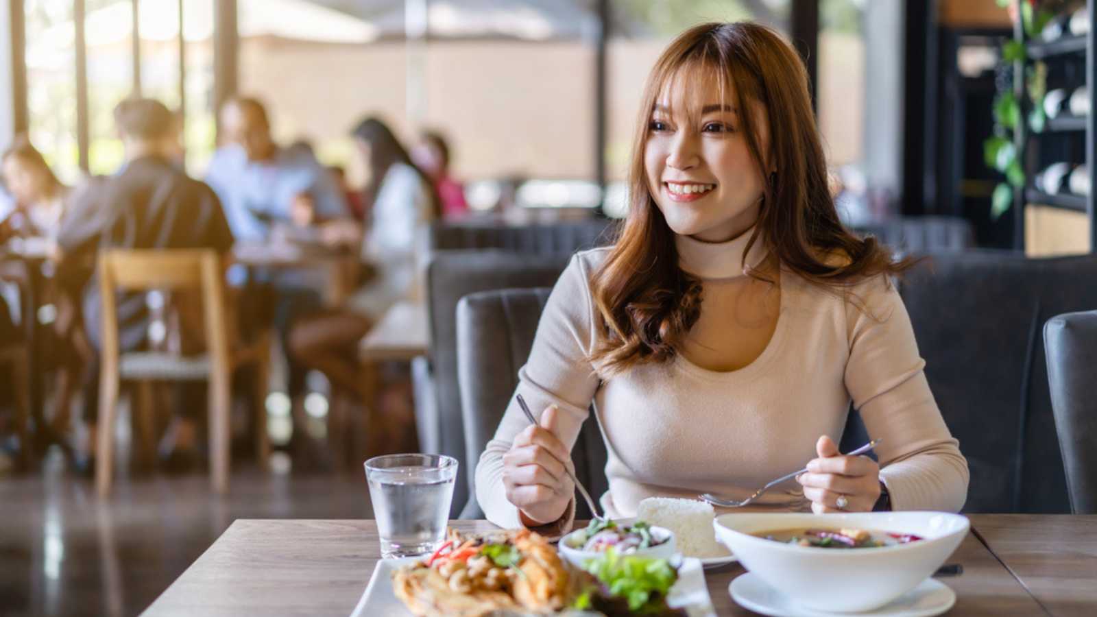 woman eating at restaurant