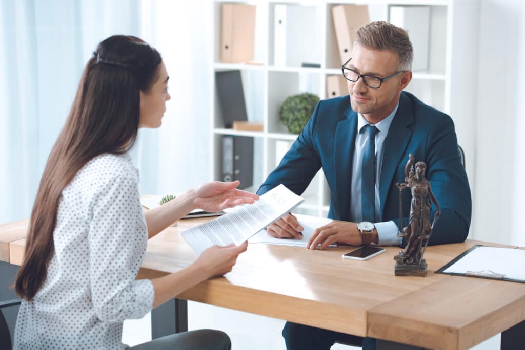 A young woman discussing something with a consultant