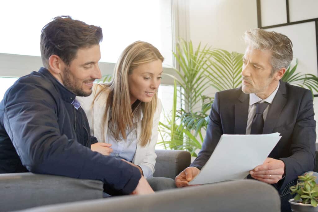 Couple looking over an agreement paper