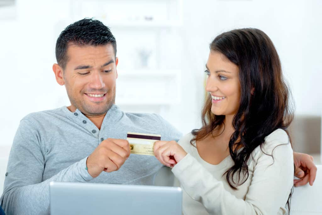 A couple holding a card